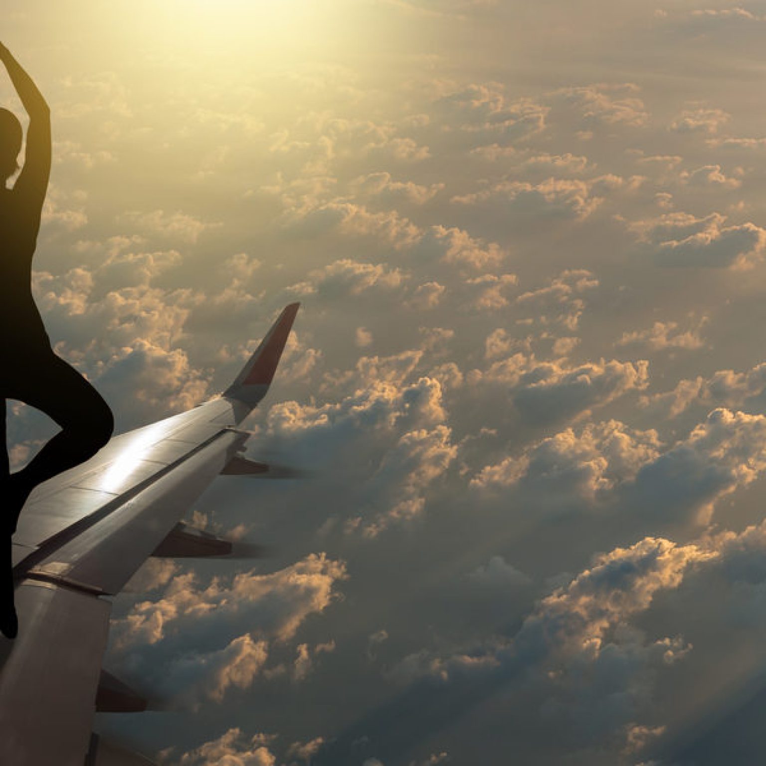 Watch These People Actually Practice In-Flight Yoga