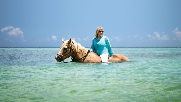 Martha Stewart horseback riding in the Caribbean.