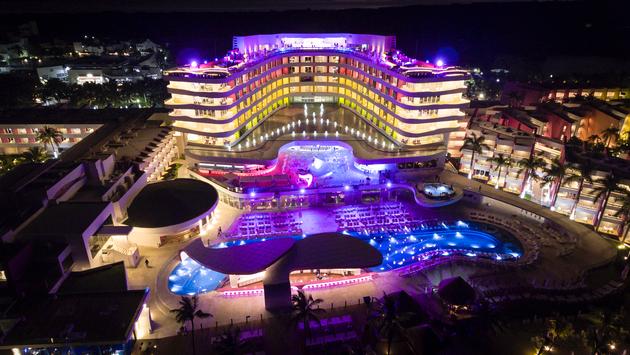 Aerial view of Temptation Cancun Resort at night.