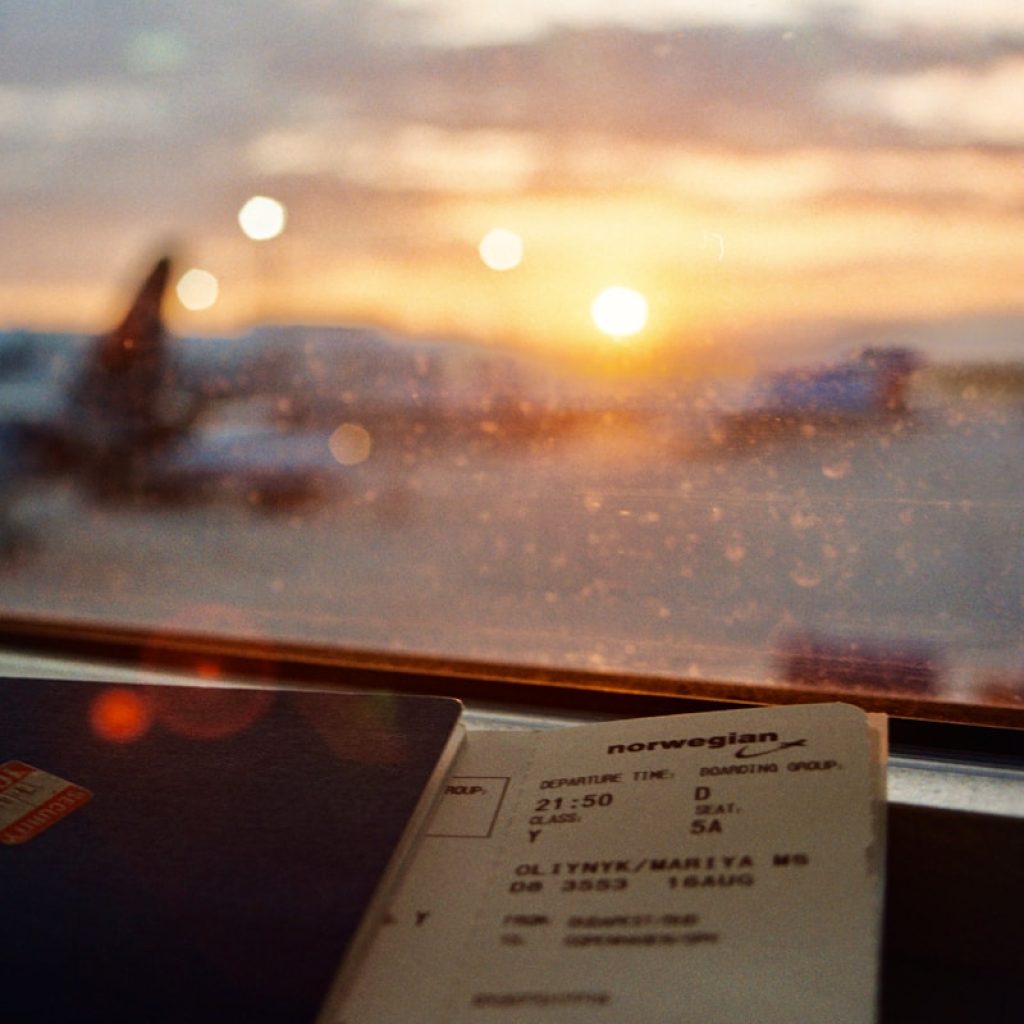white printer paper on glass window during sunset