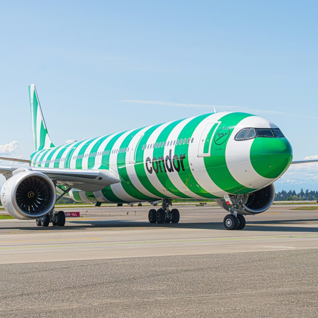 a large jetliner sitting on top of an airport runway