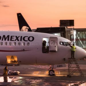 white and blue passenger plane on airport during daytime