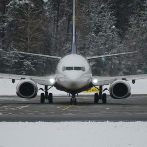 a large jetliner sitting on top of an airport runway