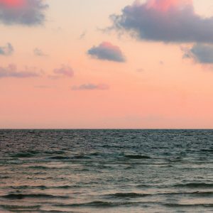 body of water under cloudy sky during daytime