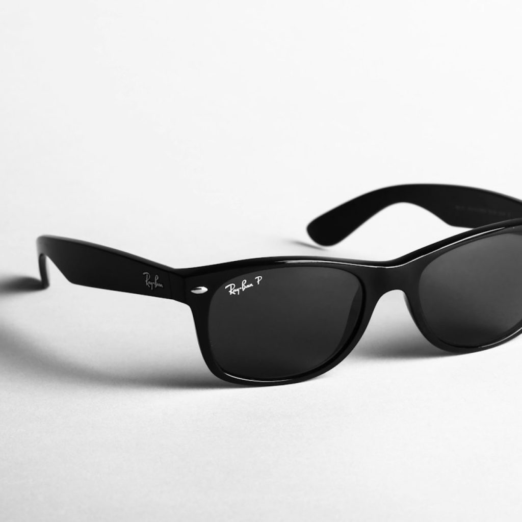 shallow focus photo of black Ray-Ban wayfarer sunglasses