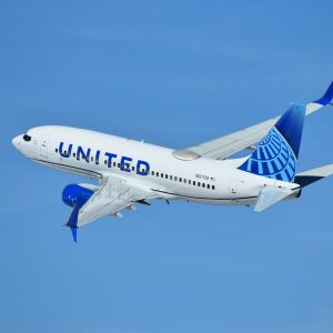 a united airlines plane flying in the sky